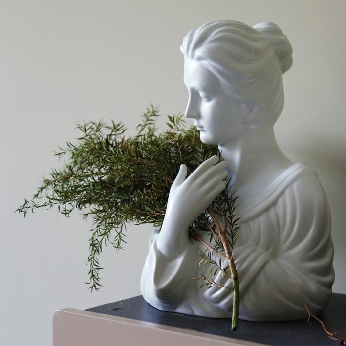 Resin Figurines of  Girl with Seabuckthorn in Her Arms